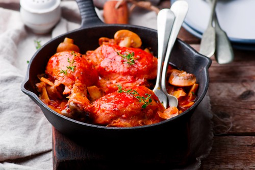 Kuře Marengo Marengo chicken in a frying pan. . selective focus