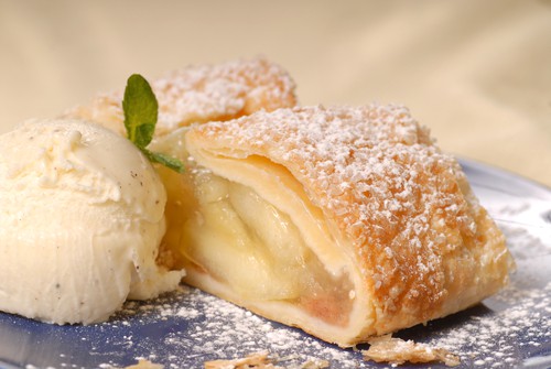 Slicke of apple strudel with vanilla ice cream