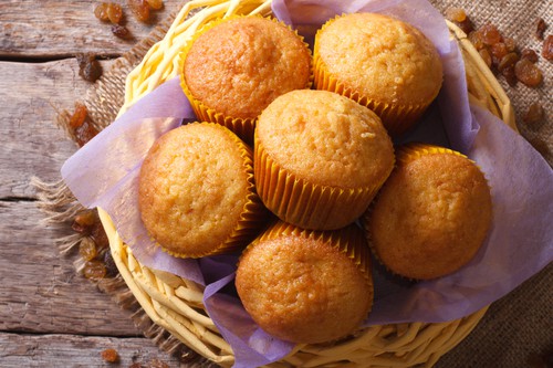 Orange muffins and raisins close-up. horizontal top view